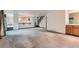 Open-concept living space with breakfast bar and staircase at 9670 W 70Th Ave, Arvada, CO 80004