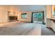 Cozy living room with brick fireplace and access to the outdoor balcony at 9670 W 70Th Ave, Arvada, CO 80004