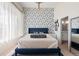 Bedroom with blue accent wall, and ensuite bathroom at 4150 Longview Ln, Boulder, CO 80301