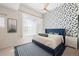 Bedroom with blue accent wall, and large windows with sheer white curtains at 4150 Longview Ln, Boulder, CO 80301