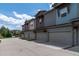 Row of townhomes featuring varied exterior finishes, garage access, and well-maintained landscaping at 4150 Longview Ln, Boulder, CO 80301