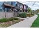 Attractive row of townhouses with well-maintained landscaping and inviting walkways on a sunny day at 4150 Longview Ln, Boulder, CO 80301