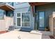 Inviting facade of modern townhouse featuring stylish front door, manicured garden and a stone sculpture at 4150 Longview Ln, Boulder, CO 80301