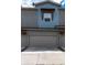 Attached garages with gray doors and wooden accents, offering convenient parking and storage at 4150 Longview Ln, Boulder, CO 80301
