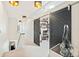Hallway with modern black sliding doors, stylish lighting, and unique decor at 4150 Longview Ln, Boulder, CO 80301