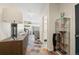 Bright hallway featuring unique multicolored tile flooring, display cabinet, and a glimpse into other rooms at 4150 Longview Ln, Boulder, CO 80301