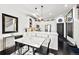 Modern kitchen with white cabinets, marble countertops, stainless steel appliances and eating area at 4150 Longview Ln, Boulder, CO 80301
