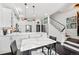 Contemporary kitchen featuring white cabinets, an island, and stylish dining area with pendant lighting at 4150 Longview Ln, Boulder, CO 80301