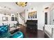 Open-concept living area with modern kitchen, elegant seating, piano, and stylish décor at 4150 Longview Ln, Boulder, CO 80301