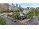 Aerial view of commercial building surrounded by urban cityscape and mature trees in Denver at 1650 N Pennsylvania St, Denver, CO 80203