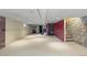Unfinished basement with painted walls, concrete floor, and exposed ceiling at 1650 N Pennsylvania St, Denver, CO 80203