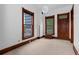 Bright bedroom featuring large windows, natural light, and detailed wood trim at 1650 N Pennsylvania St, Denver, CO 80203