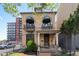 Stunning two-story home with charming balconies, decorative facade, and manicured front yard at 1650 N Pennsylvania St, Denver, CO 80203