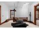 Open hallway with a decorative light fixture, radiator, cowhide rug, and a unique bench at 1650 N Pennsylvania St, Denver, CO 80203