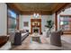 Cozy living room with a decorative fireplace, large windows, and comfortable seating at 1650 N Pennsylvania St, Denver, CO 80203