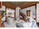 Elegant living room featuring a decorative ceiling, wood trim, and a staircase at 1650 N Pennsylvania St, Denver, CO 80203
