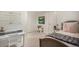 This bedroom features a writing desk and decorative dollhouse at 374 Holly St, Denver, CO 80220