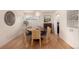 Cozy dining room with a round table and stylish chandelier at 374 Holly St, Denver, CO 80220