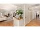 Hallway with hardwood floors and mirror at 374 Holly St, Denver, CO 80220