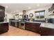 Well-equipped kitchen featuring dark wood cabinets, stainless steel appliances, and a functional design at 374 Holly St, Denver, CO 80220