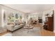 Bright living room featuring stylish furniture, large windows, and an open layout ideal for modern living at 374 Holly St, Denver, CO 80220