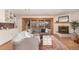 Bright living room featuring stylish furnishings, a fireplace, and seamless indoor-outdoor living at 374 Holly St, Denver, CO 80220