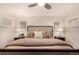 Comfortable main bedroom with bedside lamps, neutral tones, and ample light at 374 Holly St, Denver, CO 80220