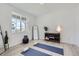 Bright, versatile room with wood floors, suitable for a yoga space or guest room at 13708 Daffodil Pt, Parker, CO 80134