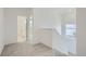 Upstairs hallway with access to a tiled bathroom and staircase with a window at 13708 Daffodil Pt, Parker, CO 80134