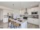 Well-lit modern kitchen with stainless steel appliances, granite counters, and island seating at 13708 Daffodil Pt, Parker, CO 80134