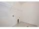 Clean laundry room with a wire shelf above and floor drain at 13708 Daffodil Pt, Parker, CO 80134