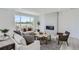 Comfortable living room with a modern fireplace, neutral tones, and scenic views at 13708 Daffodil Pt, Parker, CO 80134