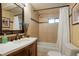 Clean bathroom with shower/tub combo and updated vanity at 6653 N Knox Ct, Denver, CO 80221