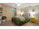 Basement bedroom with a queen bed and yellow dresser at 6653 N Knox Ct, Denver, CO 80221