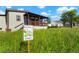 Landscaped front yard with a butterfly garden at 6653 N Knox Ct, Denver, CO 80221