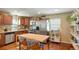 Open kitchen with breakfast bar and view into living room at 6653 N Knox Ct, Denver, CO 80221