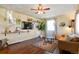 Living room features hardwood floors, a large TV, and comfy seating at 6653 N Knox Ct, Denver, CO 80221