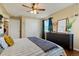 Another view of the main bedroom with dresser and closet at 6653 N Knox Ct, Denver, CO 80221