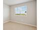 Bedroom with carpeted floor and window with blinds, offering natural light and privacy at 48229 Shetland Dr, Bennett, CO 80102