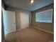 Bedroom with a window, closet with white sliding doors, neutral walls, and carpeted flooring at 48229 Shetland Dr, Bennett, CO 80102
