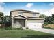Charming two-story home with landscaped front yard, covered porch, and two-car garage, perfect for suburban living at 48229 Shetland Dr, Bennett, CO 80102