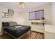 Comfortable bedroom with a queen-size bed and window blinds at 1355 Gaylord St # 10, Denver, CO 80206