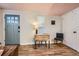 Inviting entryway with a drop leaf table and a gray door at 1355 Gaylord St # 10, Denver, CO 80206