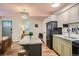 Bright kitchen with an island and modern appliances at 1355 Gaylord St # 10, Denver, CO 80206