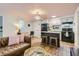 Open kitchen with island, granite countertops, and modern appliances at 1355 Gaylord St # 10, Denver, CO 80206