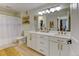 Bright bathroom featuring dual sinks, a bathtub, and neutral-toned decor at 1881 Mallard Dr # 1881, Superior, CO 80027