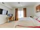 Large bedroom featuring a TV, desk and an adjacent window at 1881 Mallard Dr # 1881, Superior, CO 80027