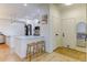 Stylish entryway leads to modern kitchen with sleek countertops and convenient breakfast bar seating at 1881 Mallard Dr # 1881, Superior, CO 80027