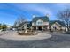 Inviting community entry with beautiful landscaping, circular drive, and decorative monument at 1881 Mallard Dr # 1881, Superior, CO 80027
