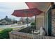 Relaxing patio with comfortable seating and red umbrella, offering a cozy outdoor retreat at 1881 Mallard Dr # 1881, Superior, CO 80027